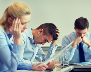 Image of office employees looking stressed - Opus Nebula